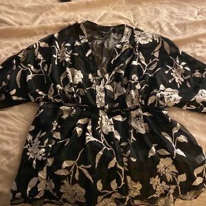 Black sheer blouse with cream/beige flower detail